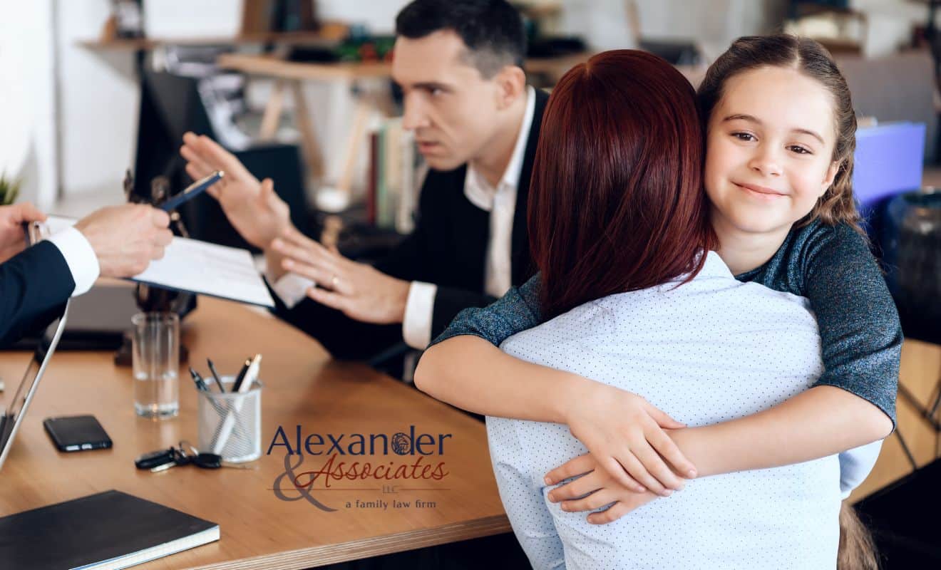 Divorced parents meeting with a child custody lawyer to make child custody modifications in Colorado.