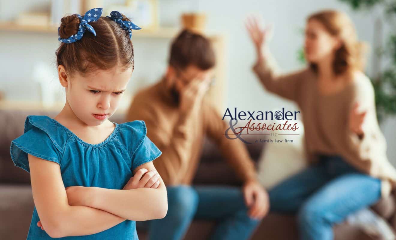 A couple going through a high-conflict divorce fighting in the room with a kid present.