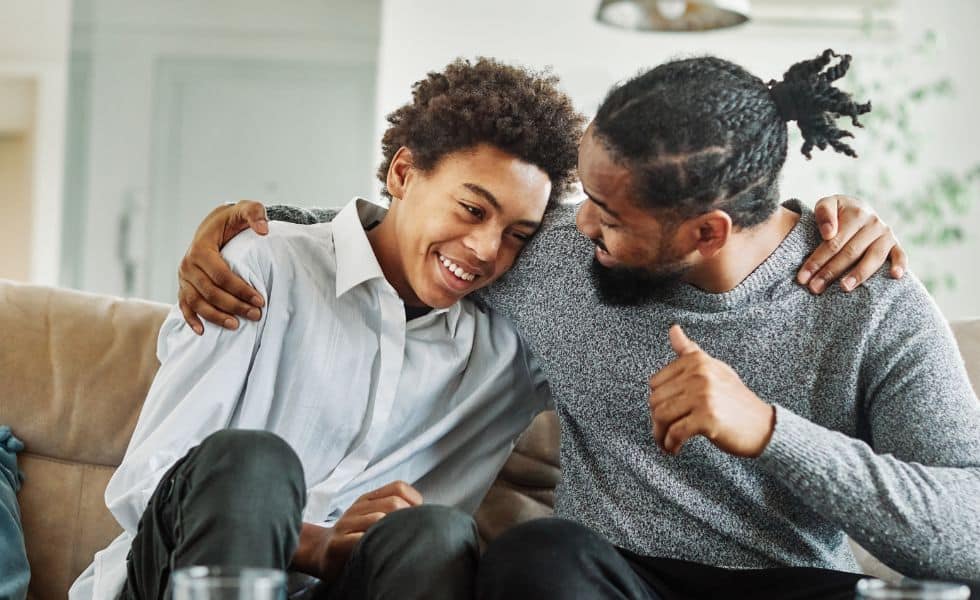 ChildCustody_WebsiteImage A father and son hugging and smiling with the help of child custody help from Alexander & Associates.